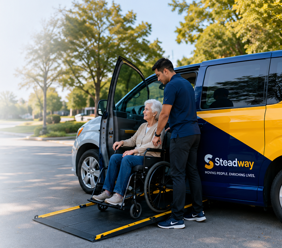 A Steadway caregiver assisting an elderly woman in a wheelchair beside an accessible van with a lowered ramp